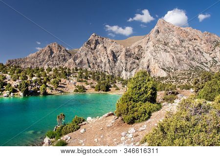 Amazing Sunny Day In Mountains. Descent Down From Mountains To The Beautiful Lake With Blue Water. S