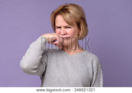 Grandmother Coering Nose From Hodor And Bad Smell From Kitchen.
