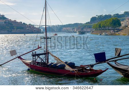 Portugal,  Porto, Red Wooden Boat With Wine Port Barrels Close Up On Douro, Porto By River,  Porto I