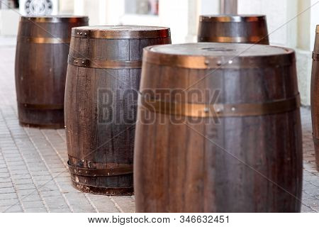 Brown Wooden Barrel On Outdoor On Stone Gray Tile, Bar Decorations Close Up Nobody.
