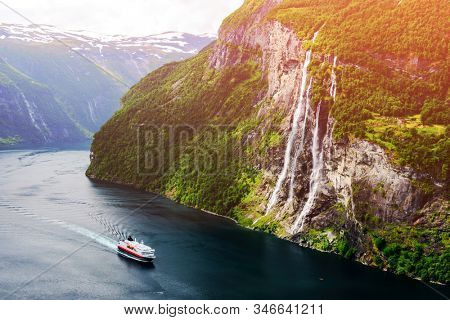 Breathtaking view of Sunnylvsfjorden fjord and famous Seven Sisters waterfalls, near Geiranger village in western Norway. Landscape photography