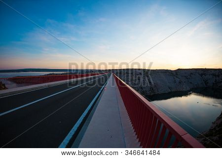 Red Bridge Over The Canyon In Croatia At Sunset. View From The Bridge To The Canyon In The Krka Nati