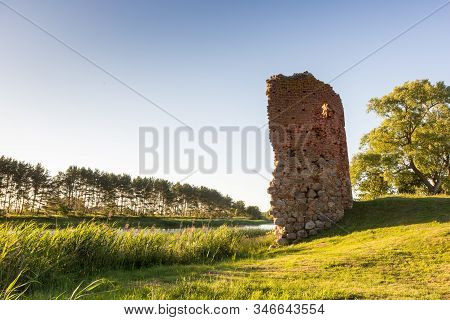 Old Castle Tower Ruins In Latvia Piltene Near River Venta