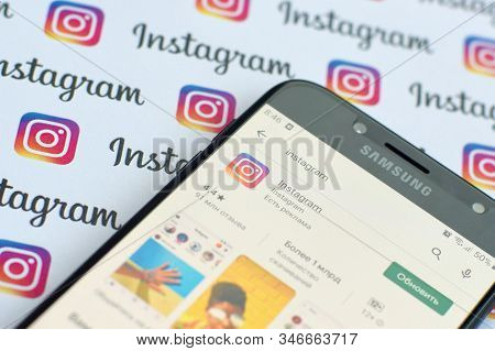 Instagram App On Samsung Smartphone Screen On Banner With Small Instagram Logos. Instagram Is Americ