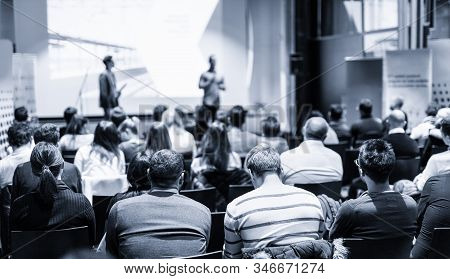 Male Public Peaker Giving Presentation On Business Conference Event.
