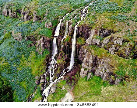 The Aerial View Of The Tallest Waterfall Near Seydisfjordur, Iceland During Summer