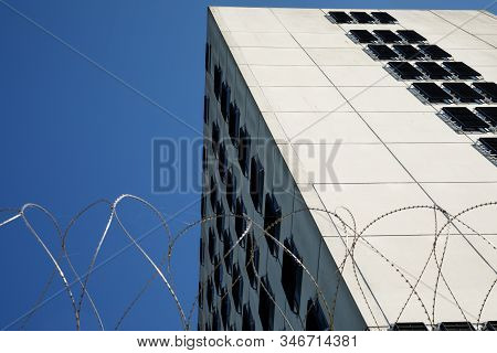 Amsterdam, Netherlands June 29, 2019: A Prison Building Named Bijlmer Bajes With Barbed Wire Fence.