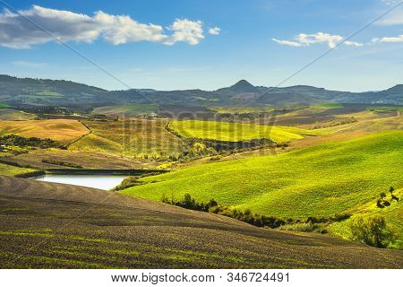 Volterra Panorama, Rolling Hills, Green Fields And Small Lake. Tuscany, Italy Europe.