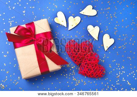 Beautiful Red And Wooden Hearts With A Present On The Cornflowerblue Background In The Golden Star S