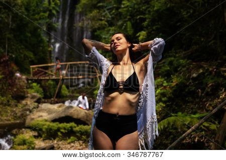 Woman near Labuhan Kebo Waterfall located in Munduk, Bali