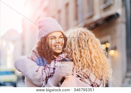Happy Brightful Positive Moments Of Two Stylish Girls Friends Hugging On Street. Closeup Portrait Fu