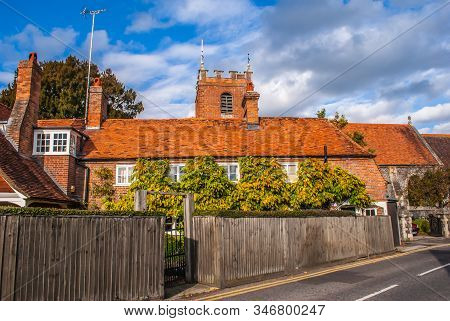 Pangbourne, Berkshire, England. October 29 2011. St. James The Less Church Tower Showing Above A Row