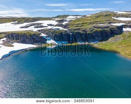 Mountain Lake Flotvatnet With Waterfall. Scenic Region Between Aurland And Laerdal In Norway. Nation