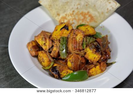 Top Down View Of Paneer Shimla Mirch Or Paneer Capsicum Or Tofu Capsicum On A Grey Background, Selec