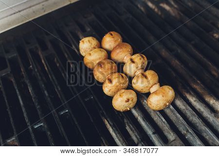Cooking Mushrooms On The Grill In The Restaurant.
