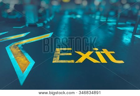 Exit background, big yellow arrow to exit from subway, direction sign, conceptual imahe of the way out, urban life, modern underground system 