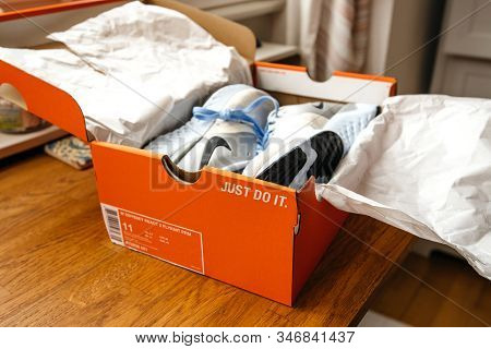 Paris, France - Sep 23, 2019: Unboxing Unpacking On Wooden Table Pair Of New Nike Female Running Pro