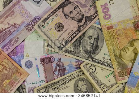 Multicurrency Background Of The Us Dollars, Russian Rubles And Ukrainian Hryvnias