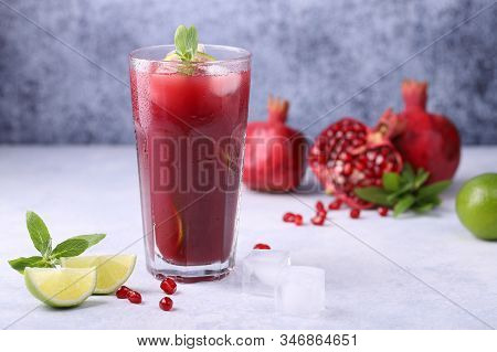 A Cold, Refreshing, Delicious Cocktail Made From Natural Pomegranate Juice, Lime, Mint And Ice Cubes