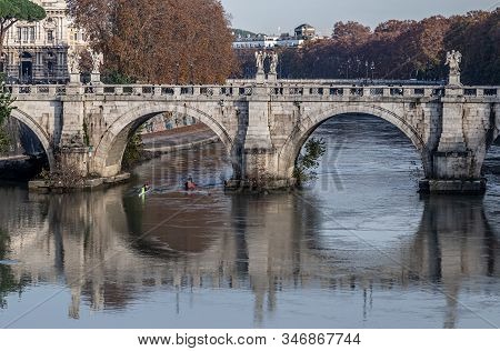 Rome, Italy - December 06, 2019:  Group Of People Training On Kayak. Sightseeing Boat Floating Near 