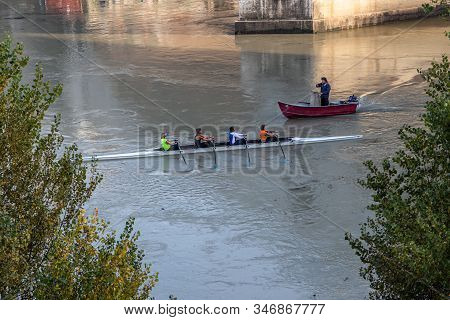 Rome, Italy - December 06, 2019:  Group Of People Training On Kayak. Sightseeing Boat Floating Near 