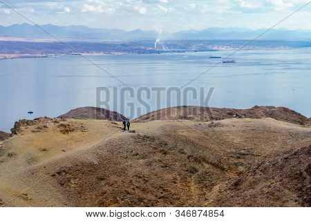 Eilat, Israel - January 18, 2020: View Of The Gulf Of Aqaba, With Hikers. Eilat Mountains, Southern 