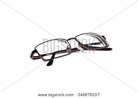 Glasses In A Metal Frame Isolated On A White Background. Glasses With Plastic Earhooks. Copy Space.