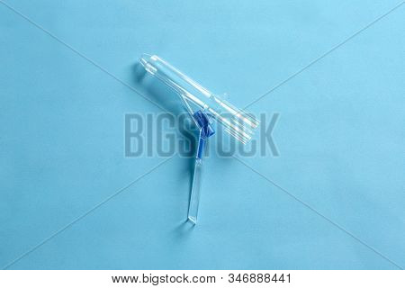 Anoscope On Light Blue Background, Top View. Hemorrhoid Treatment