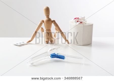Composition With Anoscope On White Background. Hemorrhoid Treatment