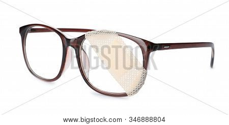 Glasses With Sticking Plaster Isolated On White