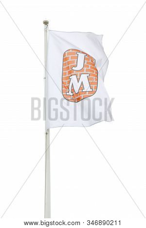 Sodertalje, Sweden - January 18, 2020: The Jm Company Flag Against A Bright Sky. Jm Is A Developer O