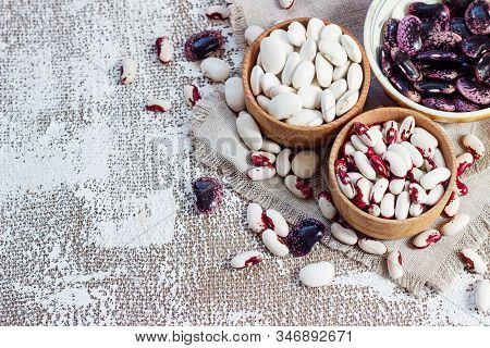 Colored Beans In Wooden Cups On A Light Background