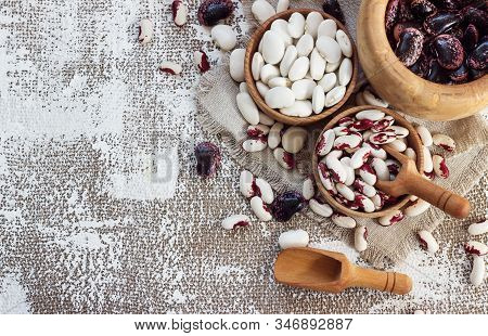 Colored Beans In Wooden Cups On A Light Background