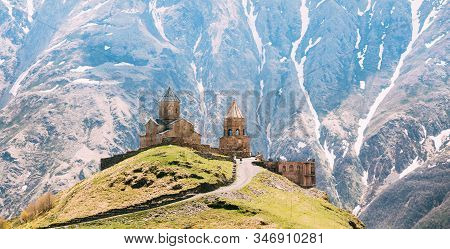 Stephantsminda, Georgia. Gergeti Trinity Church Or Tsminda Sameba - Holy Trinity Church Near Village