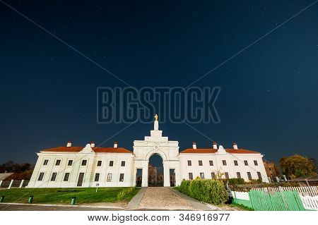 Ruzhany, Brest Region, Belarus. Night Starry Sky Above Gate To Ruzhany Palace Famous Popular Histori