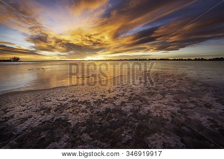 Colorful Sunrise On The Frozen Lake