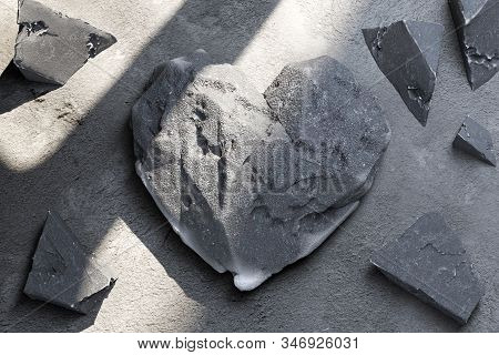 Heart Made Of Concrete Or Stone Near Stone Fragments. 3d Rendering.