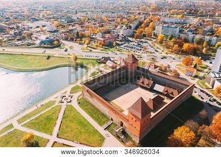 Lida, Belarus. Aerial Birds-eye View Of Cityscape Skyline. Lida Castle In Sunny Autumn Day. Famous P