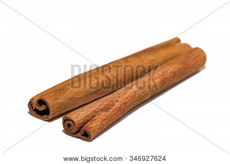 Flavored Cinnamon Sticks Isolated On A White Background. Two Sticks Of Dried Cinnamon Isolated On A 