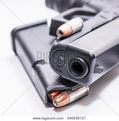 A Black 9mm Semi Automatic Pistol With A Loaded Pistol Magazine With A Single 9mm Hollow Point Bulle