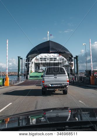 Editorial 09.03.2019 Mortavika Norway, Cars Driving On The Ferry At Mortavika That Is Transporting T