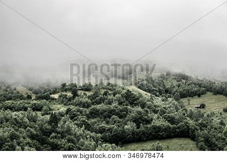 Winter Panoramic Landscape Of A Hill Forest In Moieciu De Jos, Brasov, Transylvania, Romania