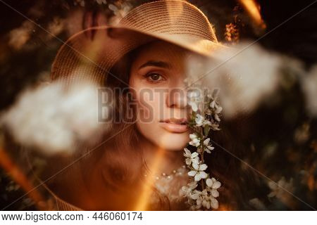 Portrait Of A Romantic Girl In A Blooming Garden With Elements Of Phantasmagoria. The Concept Of Fan