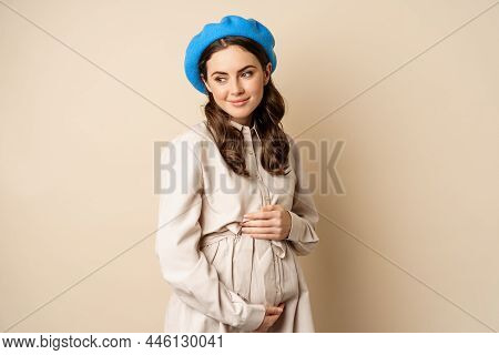 Concept Of Pregnancy And Surrogacy. Young Gentle And Tender Woman With Big Belly. Smiling Pregnant W