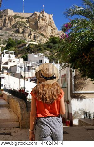 Tourist Woman Walking In The Neighborhood Santa Cruz Looking At Mount Benacantil With Santa Barbara 