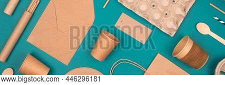 Banner. Flat Lay With Eco-friendly Tableware And Sustainable Packaging. Paper Food Packaging On Gree