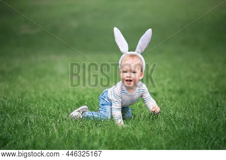 Toddler Egg Hunter Close-up In Grass With Bunny Ears.
