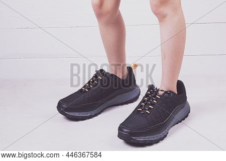 Filming In The Studio. Artificial Light. The Black-colored Adornments On The Human Leg. They Are Gre