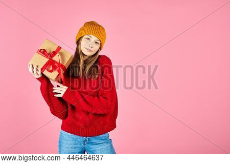 Young Smiling Happy Hipster Girl With Baces Holding Present Boxes Celebrating New Year, Wearing Red 