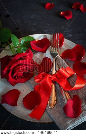Romantic Red Table Decoration On Black Table For A Valentine's Day Dinner. Vertical Background With 